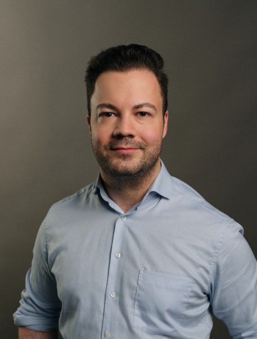 John Isufi, the author of Upward Dynamism, with the mission to empower people for sustainable AI transformation.